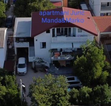 an aerial view of a building with a parking lot at Manda & Marko Jurić in Seline