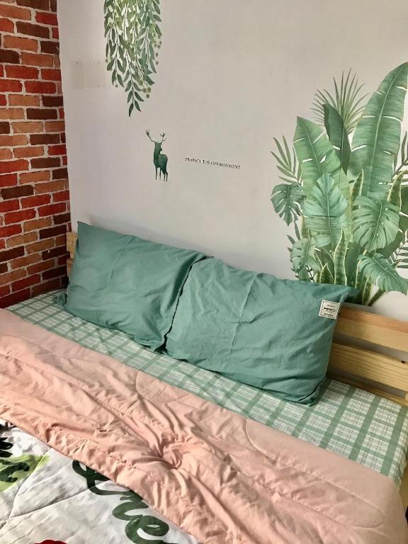 Postel nebo postele na pokoji v ubytování Green Sunshine Homestay
