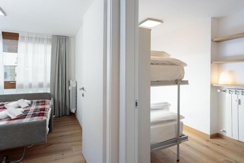 A bed or beds in a room at HelloChalet - The One - garage, bootdryer, home theatre with subwoofer, netflix, hydromassage Turkish bath