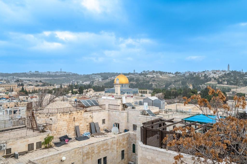 an aerial view of the old city of jerusalem with the dome of the rock at Temple mount view in Yerushalayim