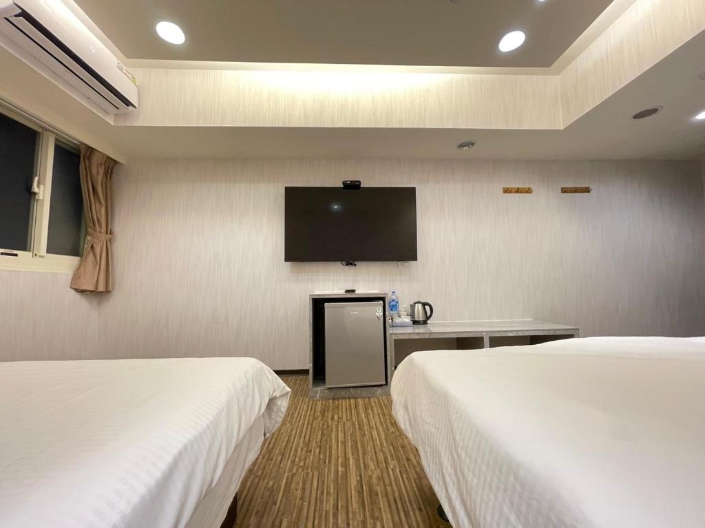 TV a/nebo společenská místnost v ubytování Jung Shin Hotel