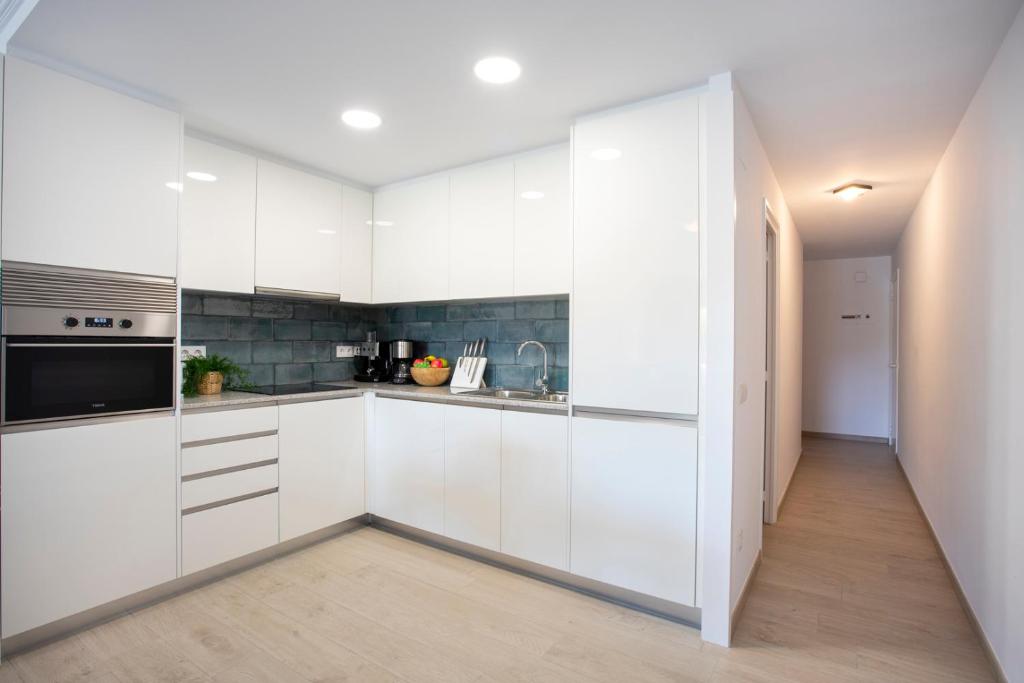 Kuchyňa alebo kuchynka v ubytovaní 1007 Apartamento planta baja Lago San Maurici by homeselectspain