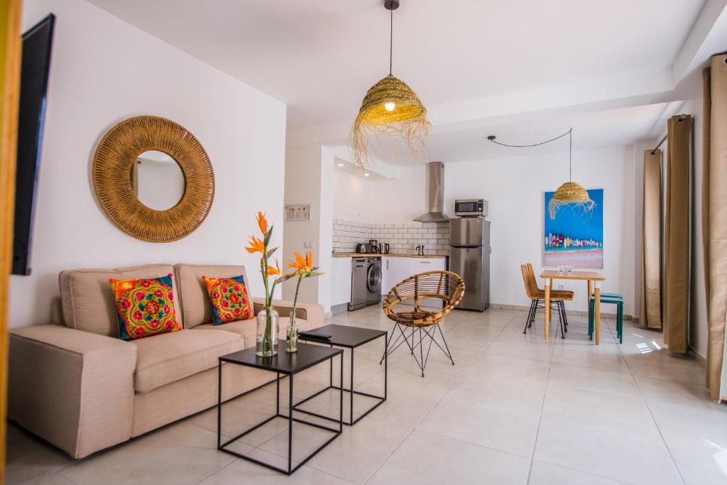 a living room with a couch and a table at La Farmacia in Gran Tarajal