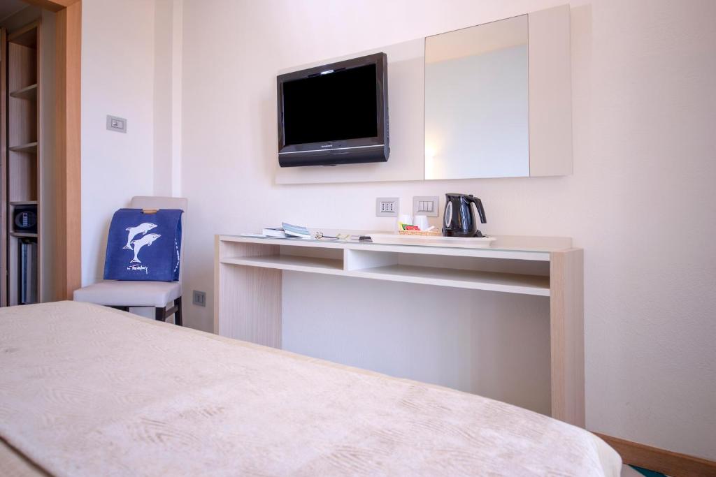 Postel nebo postele na pokoji v ubytování Hotel Calabona