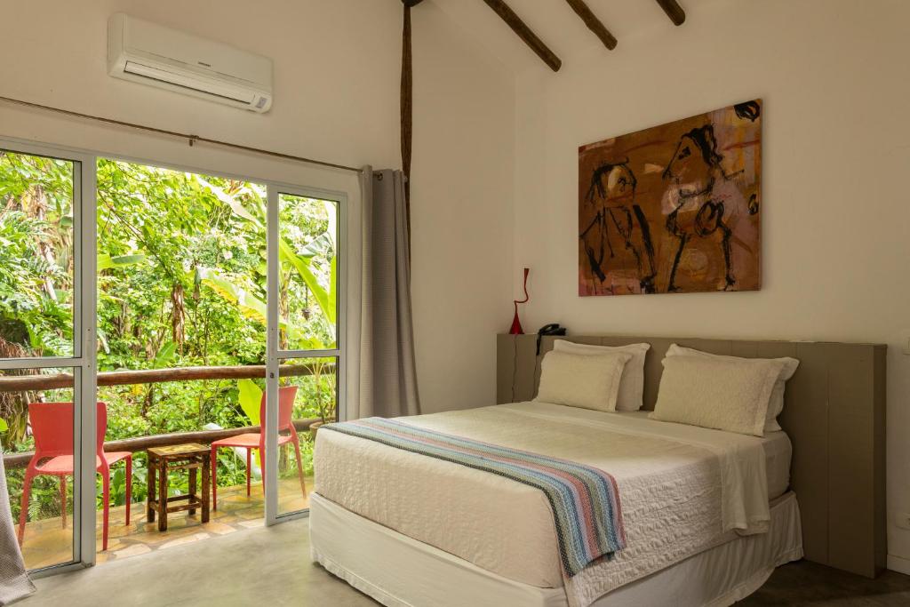 Postel nebo postele na pokoji v ubytování Hotel Boutique Ananas