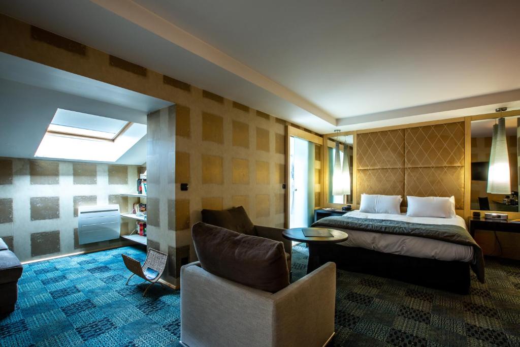 Postel nebo postele na pokoji v ubytování Hôtel Baud - Teritoria