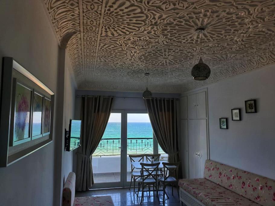 a living room with a ceiling with a view of the ocean at Your ¥achting Home in Sousse