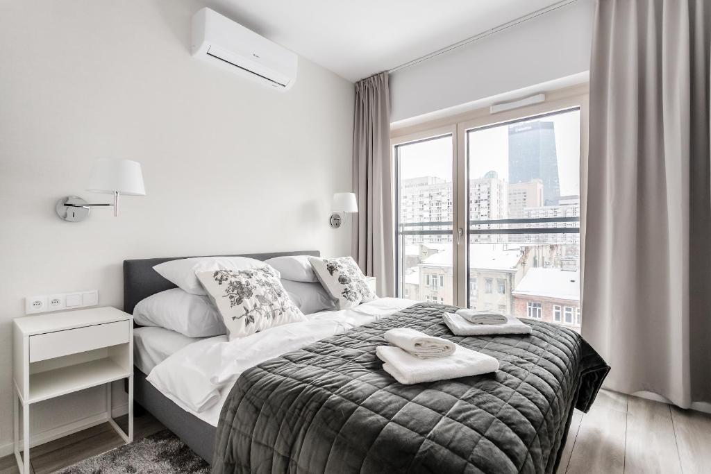 Posteľ alebo postele v izbe v ubytovaní Mennica Residence Deluxe