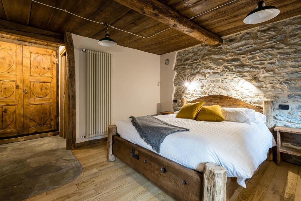 Postel nebo postele na pokoji v ubytování Chambres d'Hôtes - Li Tzatagni