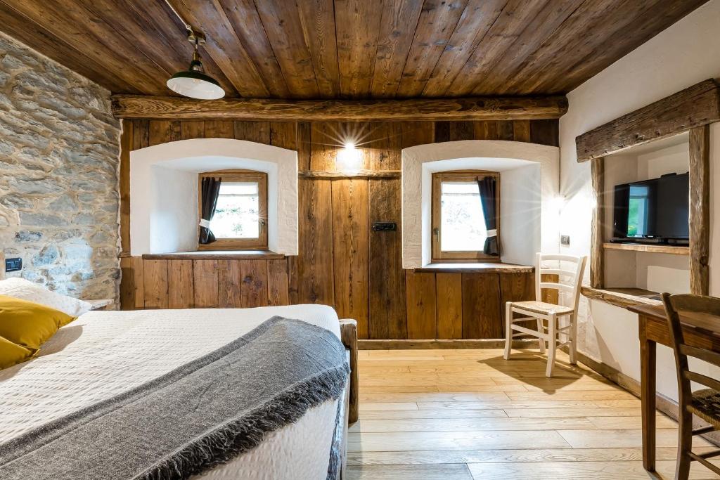 Postel nebo postele na pokoji v ubytování Chambres d'Hôtes - Li Tzatagni