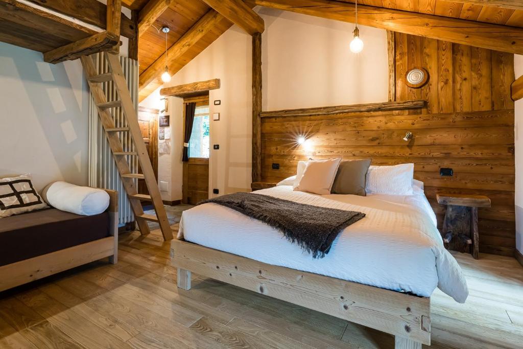 Postel nebo postele na pokoji v ubytování Chambres d'Hôtes - Li Tzatagni