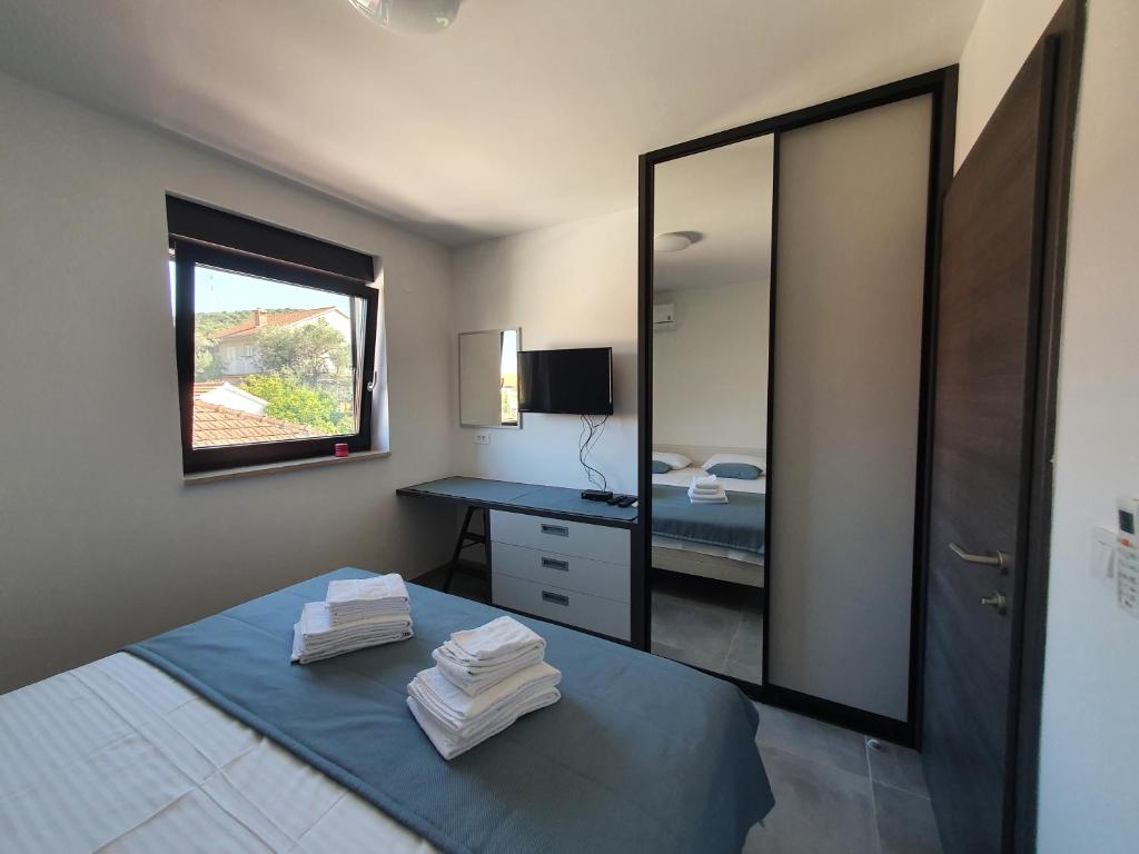 Postel nebo postele na pokoji v ubytování Apartmani Nerium