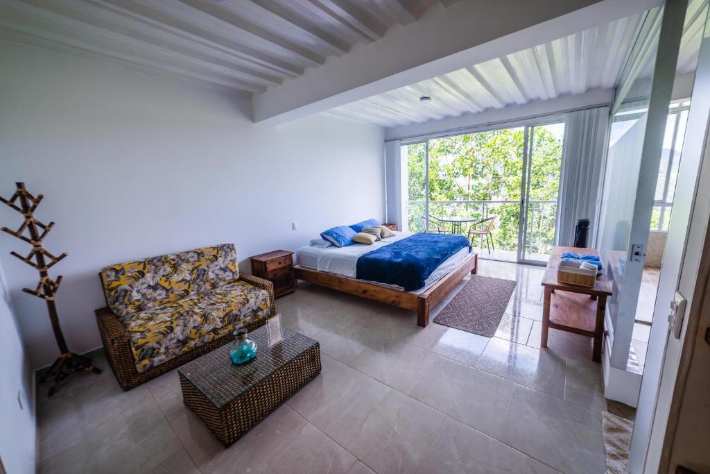 Postel nebo postele na pokoji v ubytování Tambo Eco Hotel