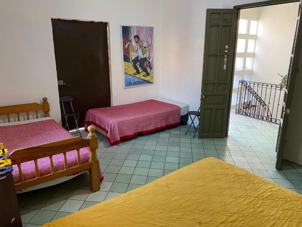 Postel nebo postele na pokoji v ubytování Hostal Santuario de las Libelulas