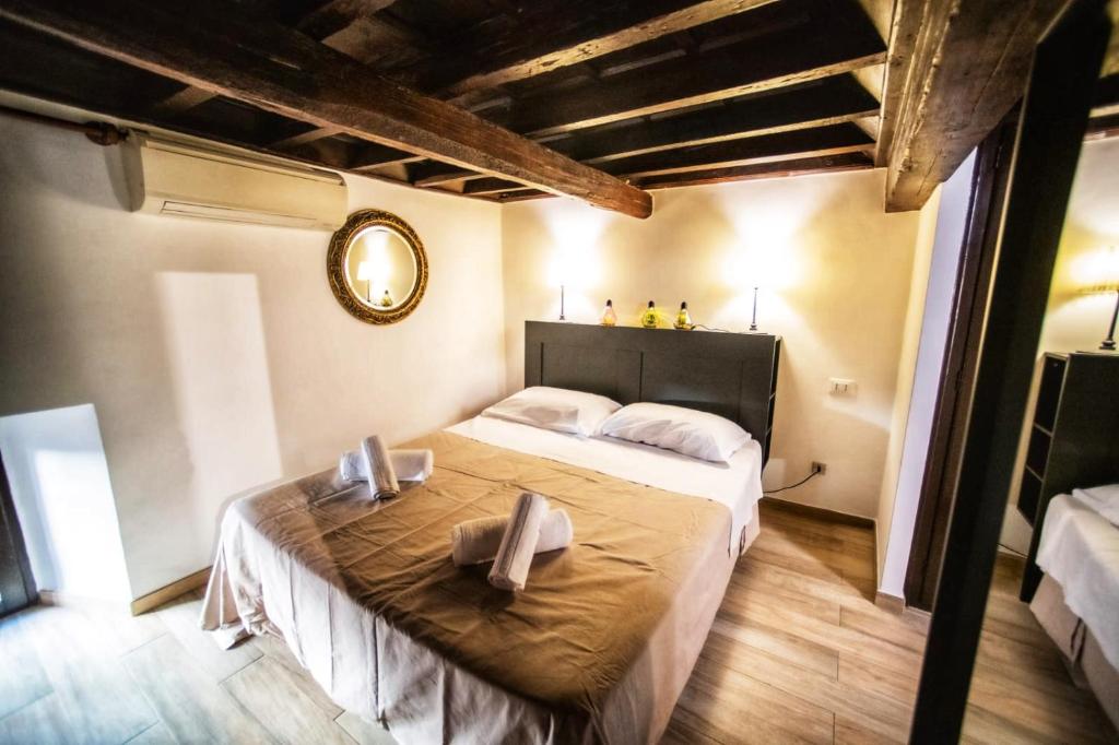 Postel nebo postele na pokoji v ubytování Rione VI Loft
