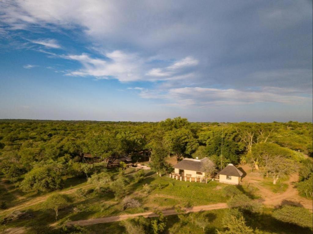 an aerial view of a house in the middle of a field at Kum Kula Lodge in Hoedspruit