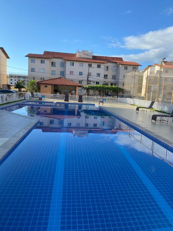 a large swimming pool in front of a building at VOG JOÃO DE GOÉS GARDEN ILHÉUS in Ilhéus
