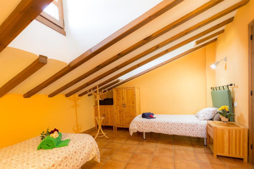 Postel nebo postele na pokoji v ubytování Casa Fresneda