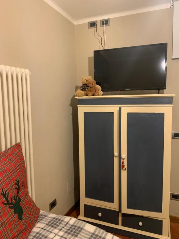 TV a/nebo společenská místnost v ubytování Il Riccio appartamento