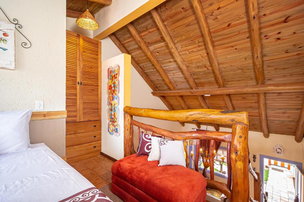 Postel nebo postele na pokoji v ubytování Casinha Ipê Roxo - Condomínio Quinta do Rosário