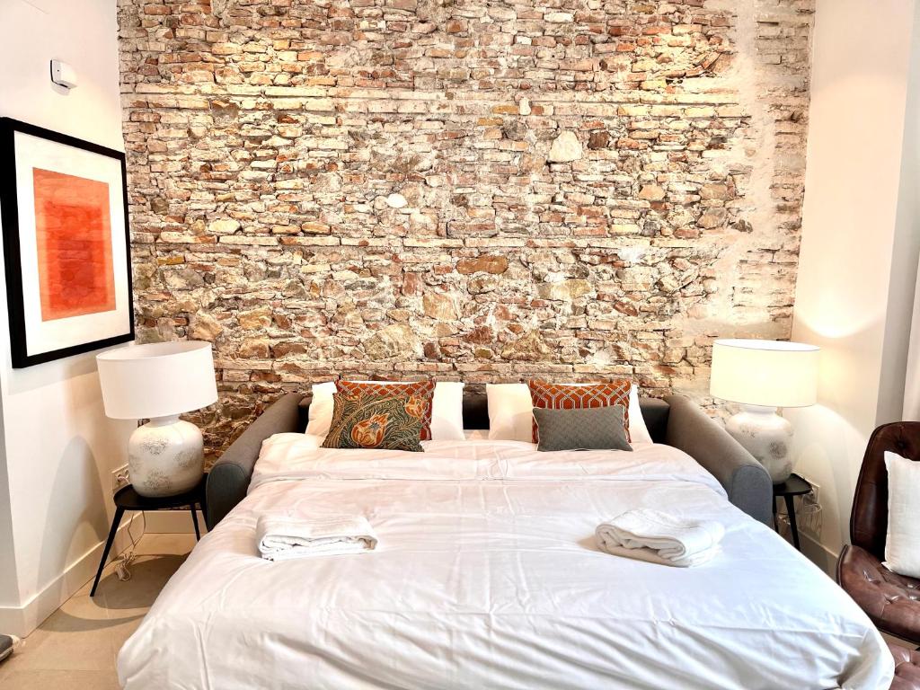 Posteľ alebo postele v izbe v ubytovaní Homely Málaga Mariblanca 17, Vegafuente Apartments