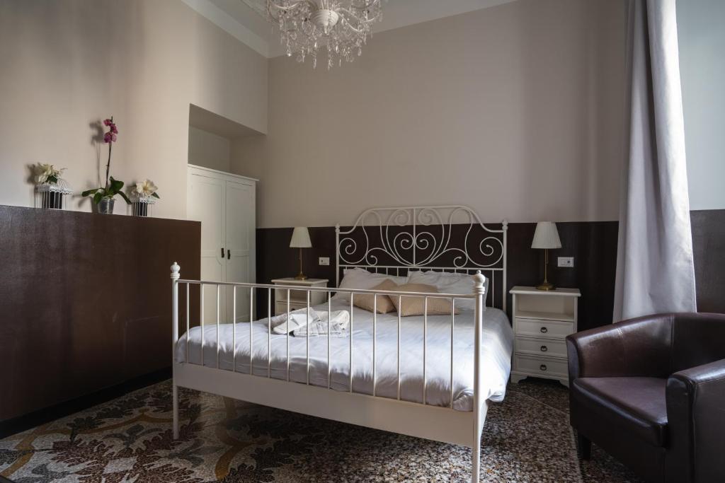 Postel nebo postele na pokoji v ubytování CORVETTO rooms