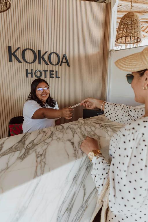 Členové personálu v ubytování Kokoa Hotel Vichayito