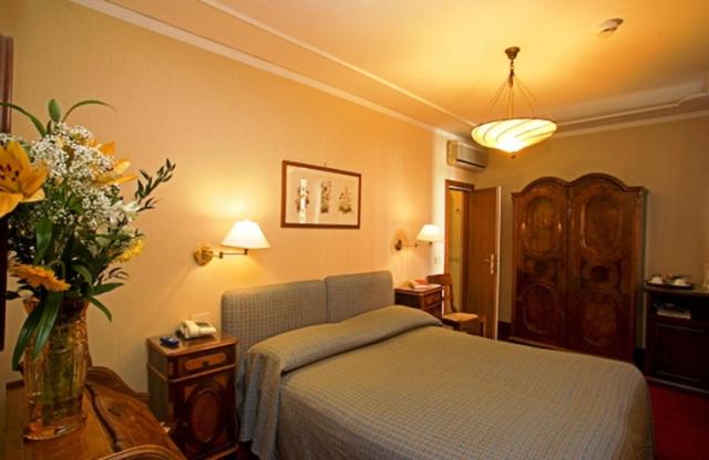 Postel nebo postele na pokoji v ubytování Hotel Agli Alboretti
