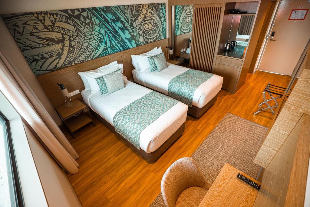Postel nebo postele na pokoji v ubytování Lava Hotel