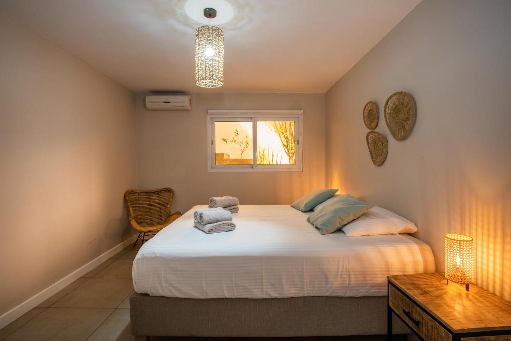 Postel nebo postele na pokoji v ubytování JT Curacao Apartments