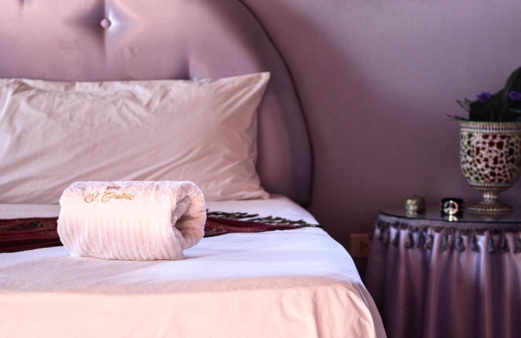 Una cama o camas en una habitación de El Castillo