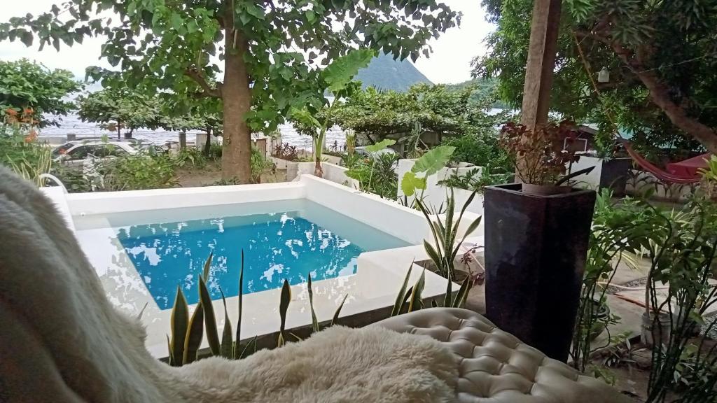 a swimming pool in the middle of a yard at Baywalk Suites Batangas in Laurel