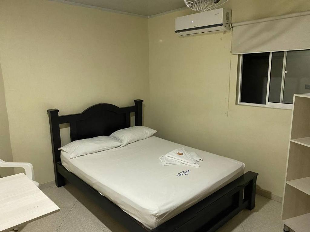 Postel nebo postele na pokoji v ubytování Hotel Villa Grant