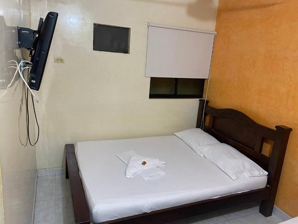 Postel nebo postele na pokoji v ubytování Hotel Villa Grant