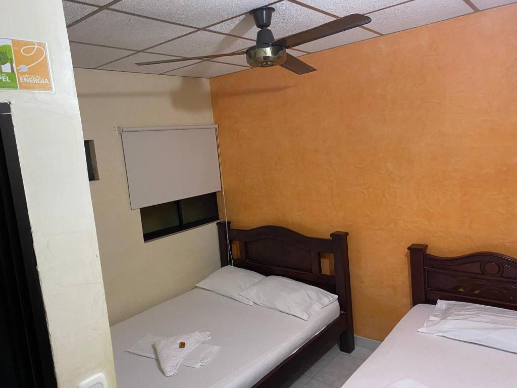 Postel nebo postele na pokoji v ubytování Hotel Villa Grant
