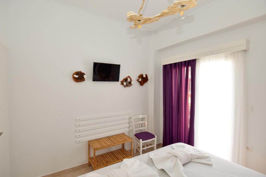 A bed or beds in a room at Rubini City Apartment