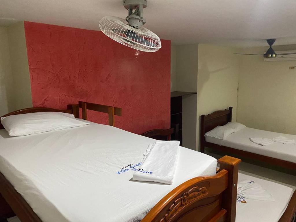 Postel nebo postele na pokoji v ubytování Hotel Villa Grant