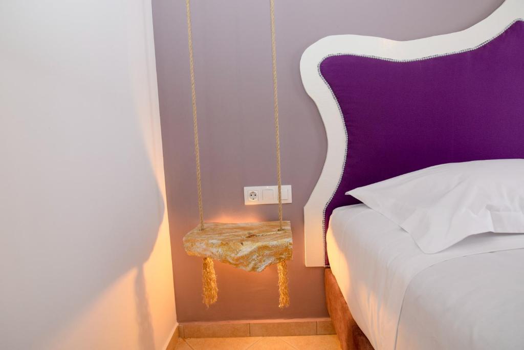 A bed or beds in a room at Rubini City Apartment