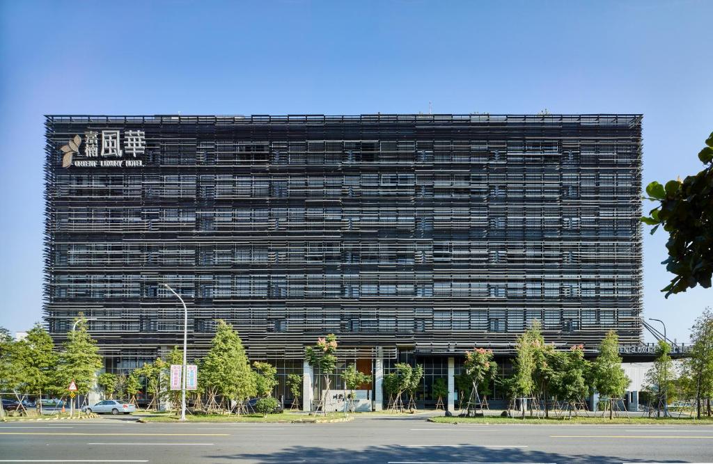 a large black building with a sign on it at Orient Luxury Hotel in Chiayi City