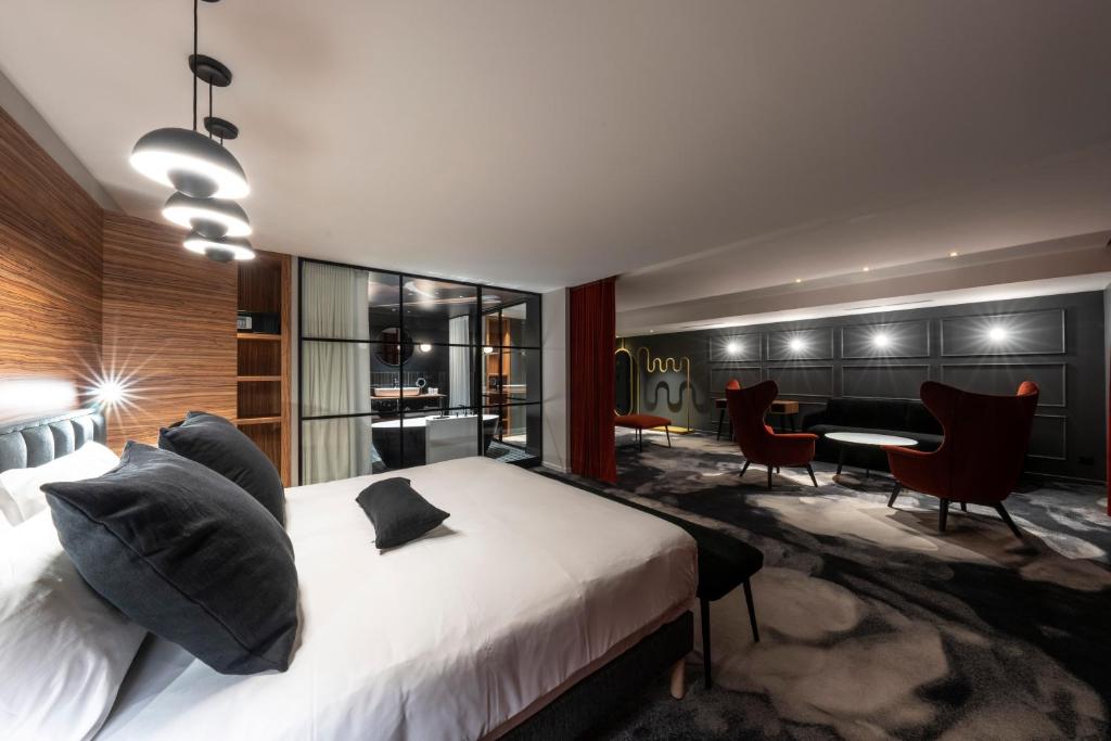 Postel nebo postele na pokoji v ubytování Hôtel Baud - Teritoria