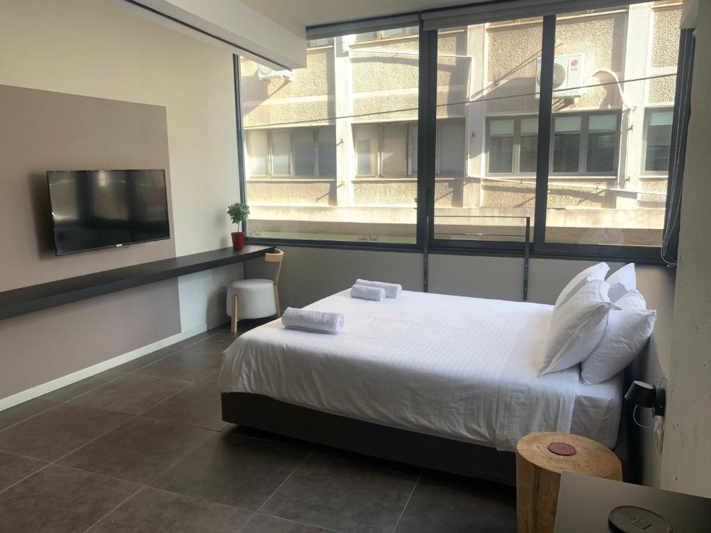Posteľ alebo postele v izbe v ubytovaní M17 Studios & Suites in the Heart of Athens