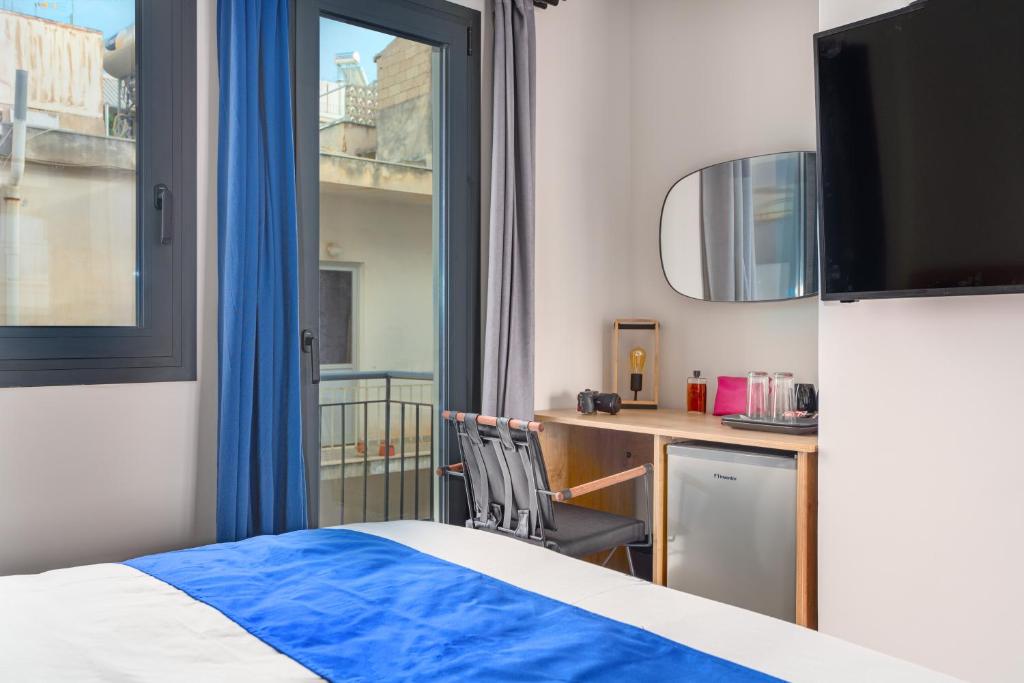 A bed or beds in a room at Exarchia House Project