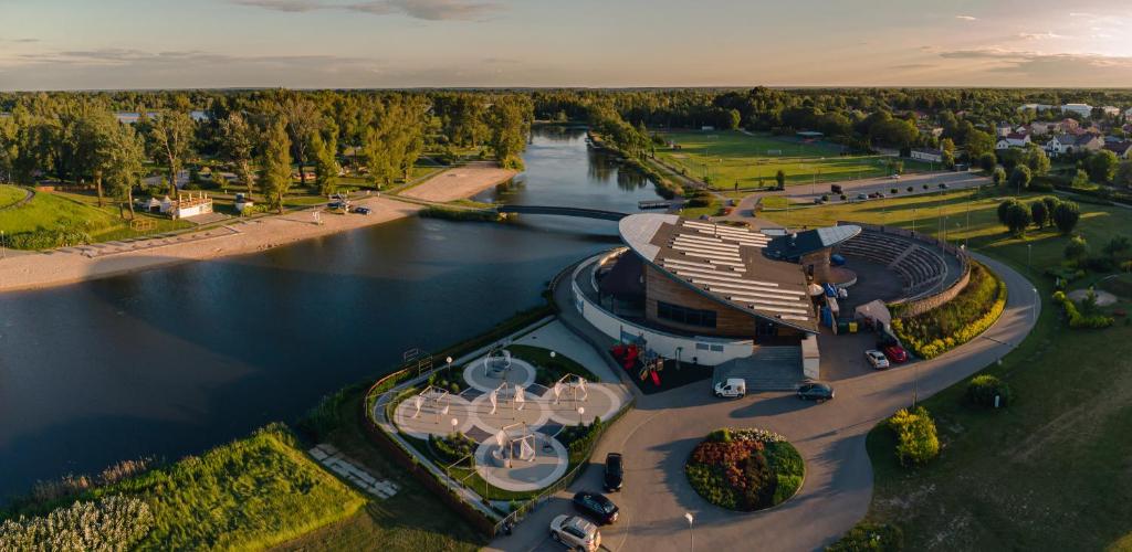 an aerial view of a building next to a river at Wyspa Wisła Przyjazna Przystań Stężyca in Stężyca