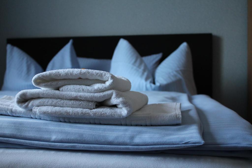 Postel nebo postele na pokoji v ubytování Occhipinti Passione - Restaurant & Hotel - Weyhausen