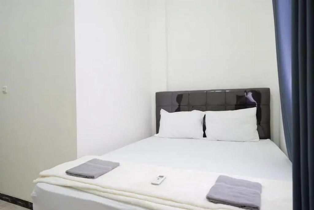 Letto o letti in una camera di Griya Mataram Kotagede Mitra RedDoorz