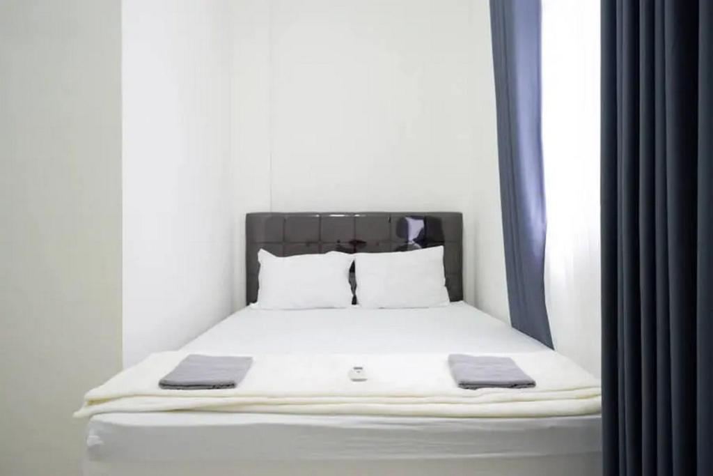 Letto o letti in una camera di Griya Mataram Kotagede Mitra RedDoorz
