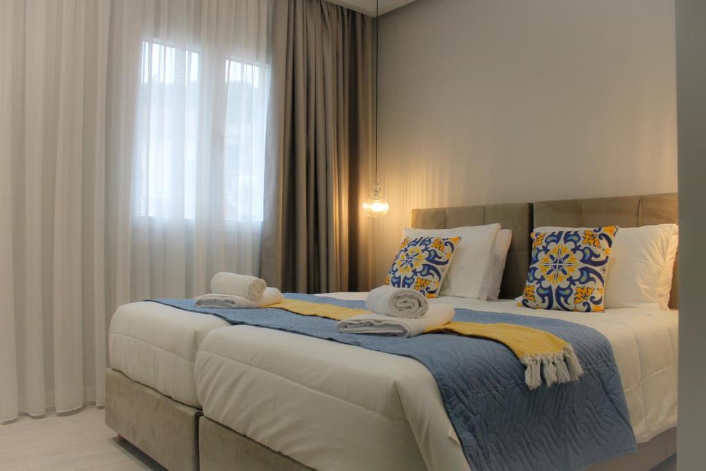 מיטה או מיטות בחדר ב-Pelagia Apartment by Kormaris