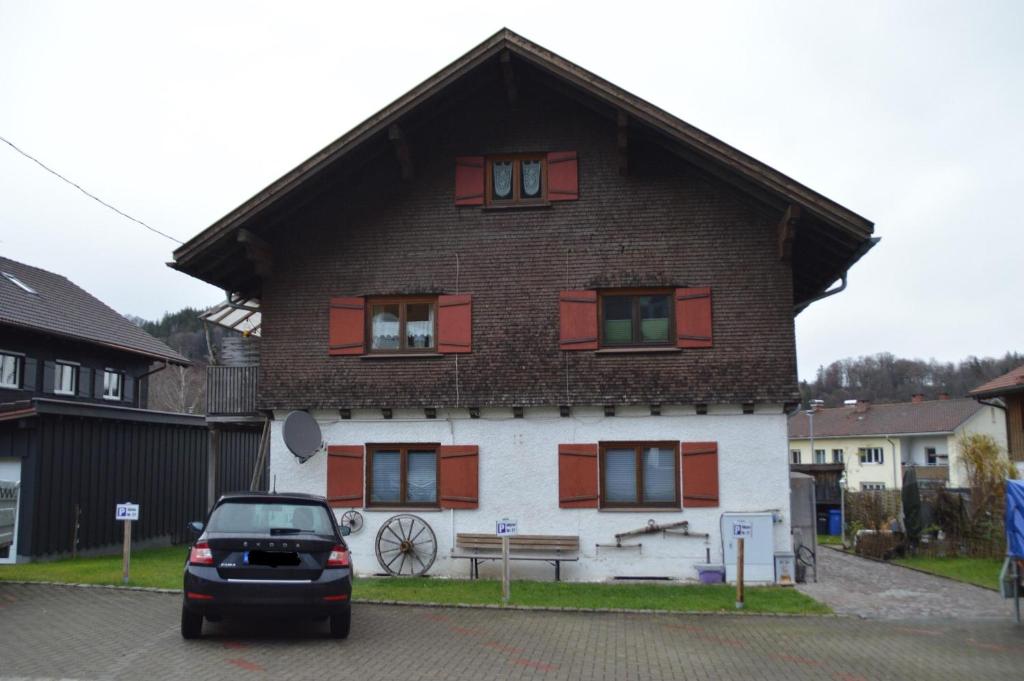 a car parked in front of a house at Ferienwohnung unterm Horn in Immenstadt im Allgäu