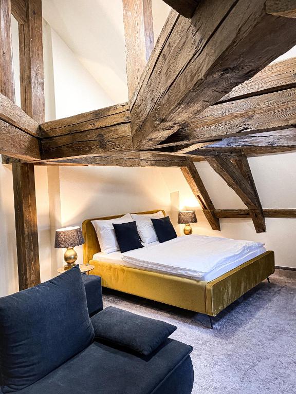 Postel nebo postele na pokoji v ubytování Zámecký hotel & Wellness