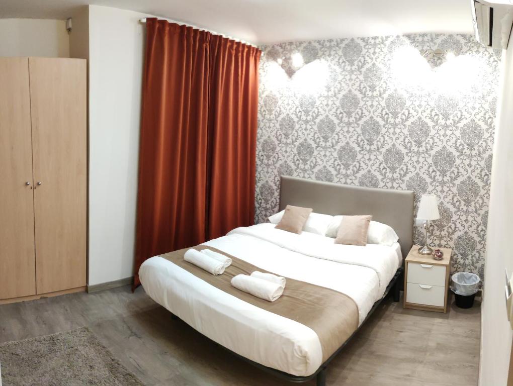 Postel nebo postele na pokoji v ubytování Guest House Barcelona Bruc